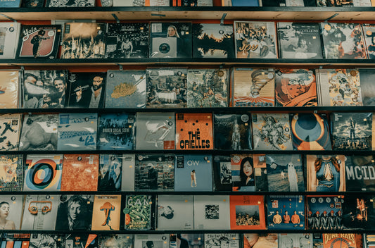 Records on a shelf symbolizing the top songs to play at a funeral