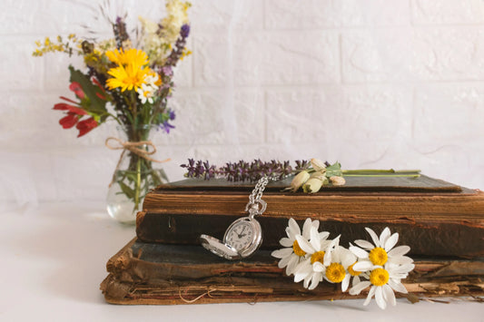 A personalized funeral display with florals and a pocket watch