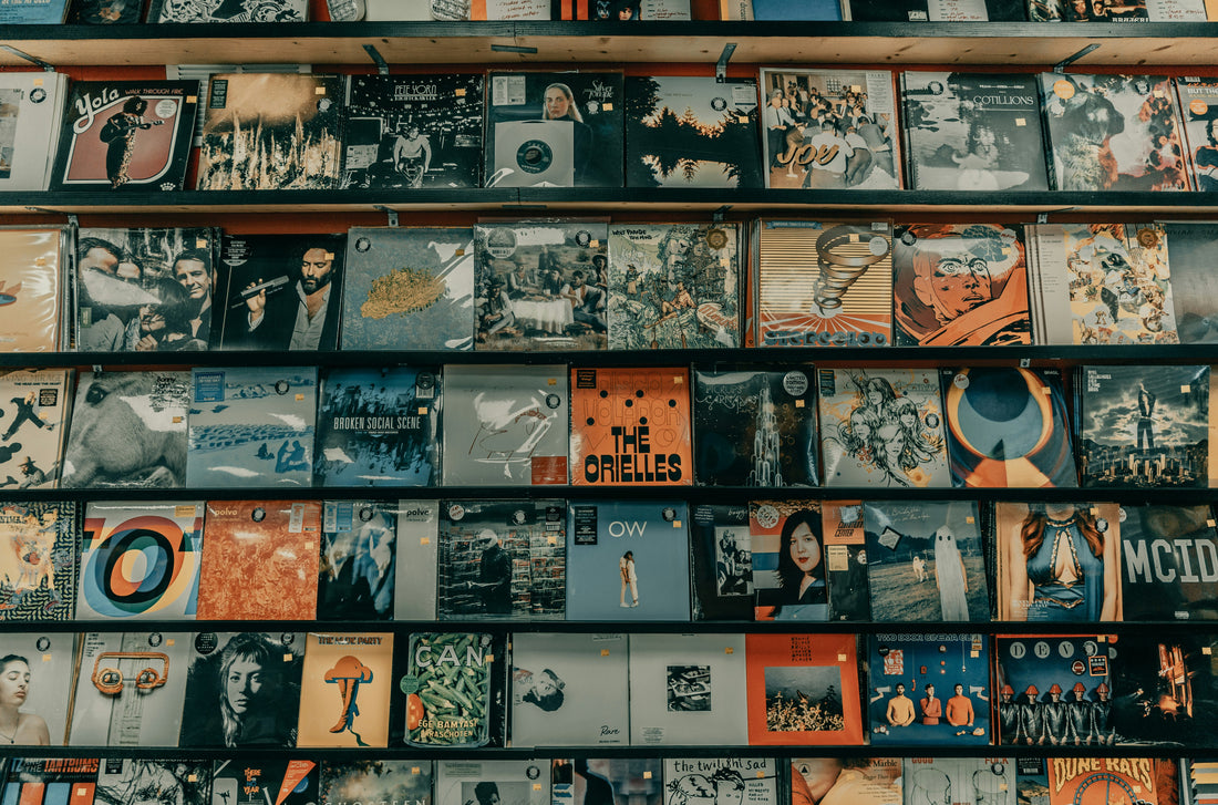 Records on a shelf symbolizing the top songs to play at a funeral